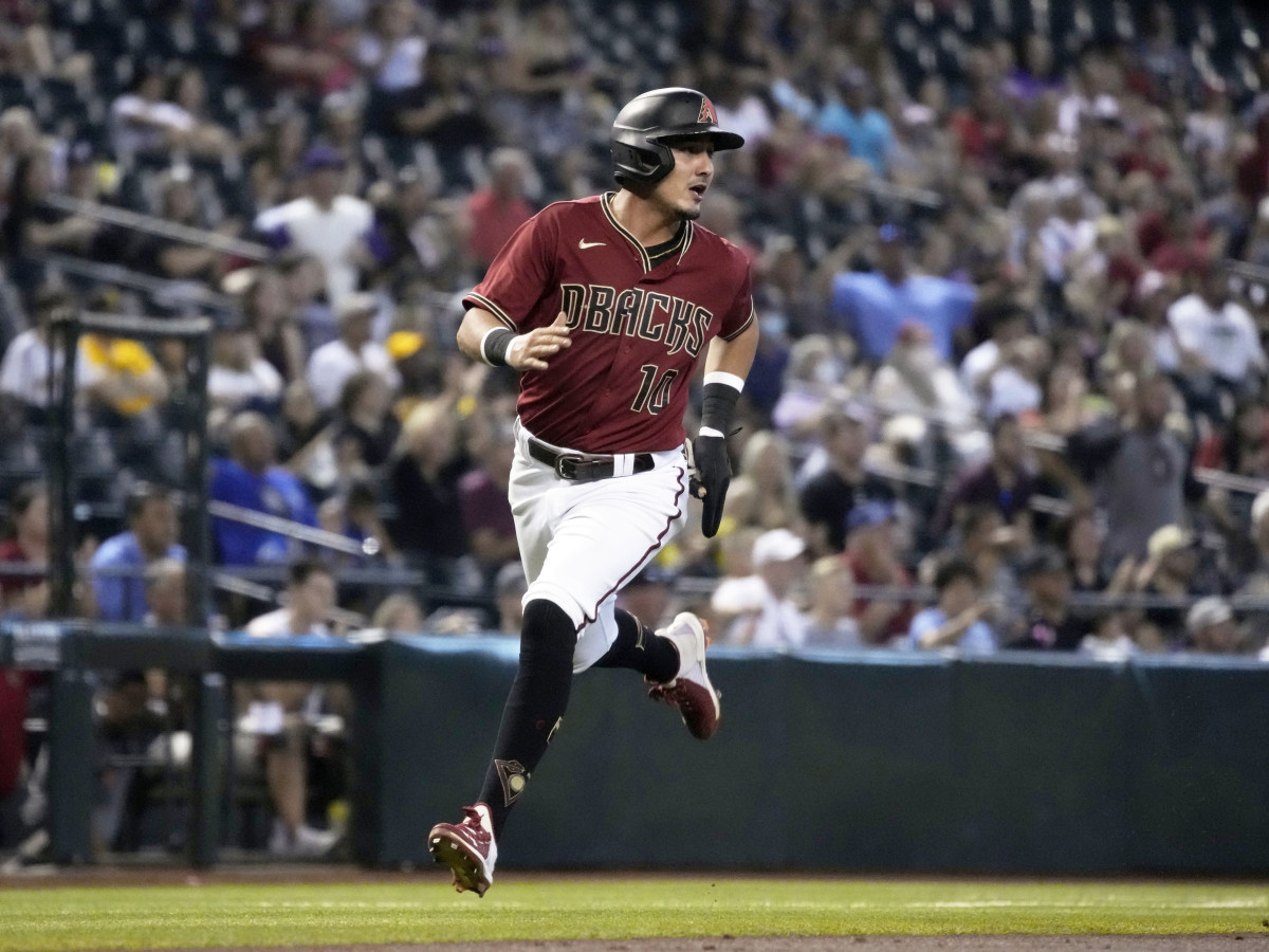 Aug 15, 2021; Phoenix, Arizona, USA; Arizona Diamondbacks third baseman Josh Rojas (10) scores a run against the San Diego Padres in the third inning at Chase Field.